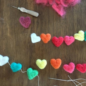 On the importance of learning the slow and steady:  Needle Felted Hearts Bunting